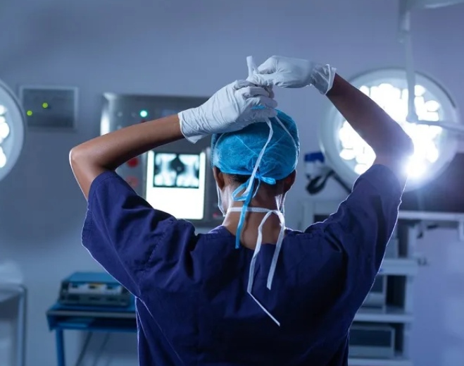 Surgeon performing procedure in operating room