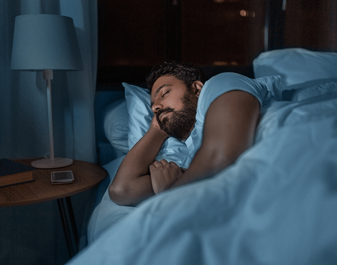 Person sleeping comfortably in bed