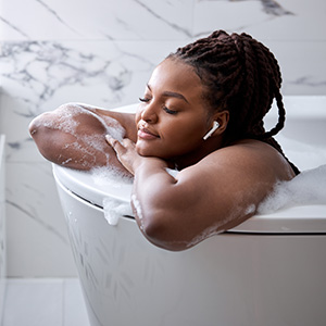 1-hotbath-adobestock_430239880_300x300 Person relaxing in bathtub with bubbles