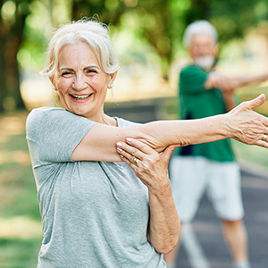 2-juststretch-adobestock_641700577_300x300 Older adult stretching during outdoor exercise