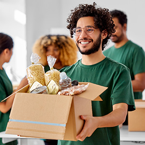 7-volunteer-adobestock_498475894_300x300 Volunteer holding food donation box